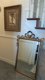 Framed mirrors in silver, gold and wood.  Framed art