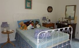 Full size iron bed.  Side tables, sewing cabinet and chair. small chest.  Mirrors