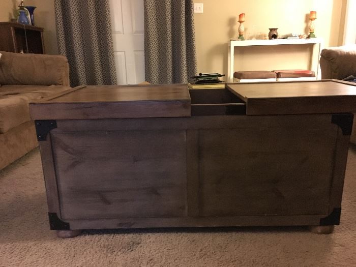 Coffee table that slides open for storage 