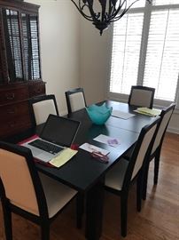 SKOVBY Dining Room Set, Black “Wenge Lacquer Finish.  Table - 36” by  71” opens to 102” with self storing leaf.  Lighted China Cabinet, Six Black Frame Chairs with White Upholstery 