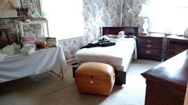 Twin bed with head and foot boards. One side table is missing the drawers in the picture but are now there