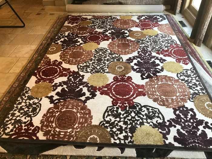 This fantastic area rug is 10'6" long x 7'6" w