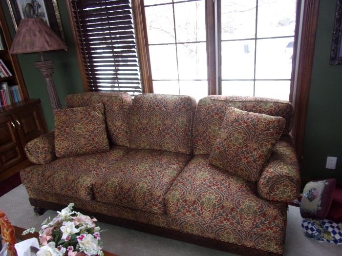 C.R. Laine sofa with wood accent and feet