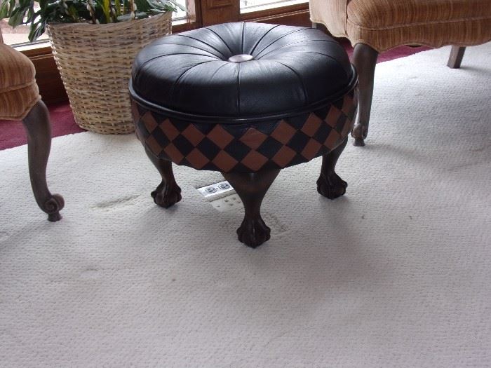 Leather ottoman with ball and claw feet
