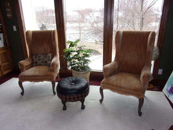 Copper wing back chairs and leather ottoman with ball and claw feet