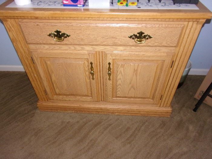 Oak cabinet/buffet with white and blue accent tile top