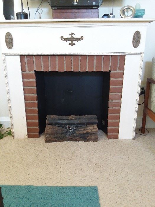 Vintage electric log fireplace. Decoration only.