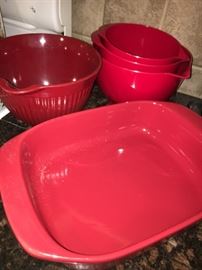 Red cookware and mixing bowls
