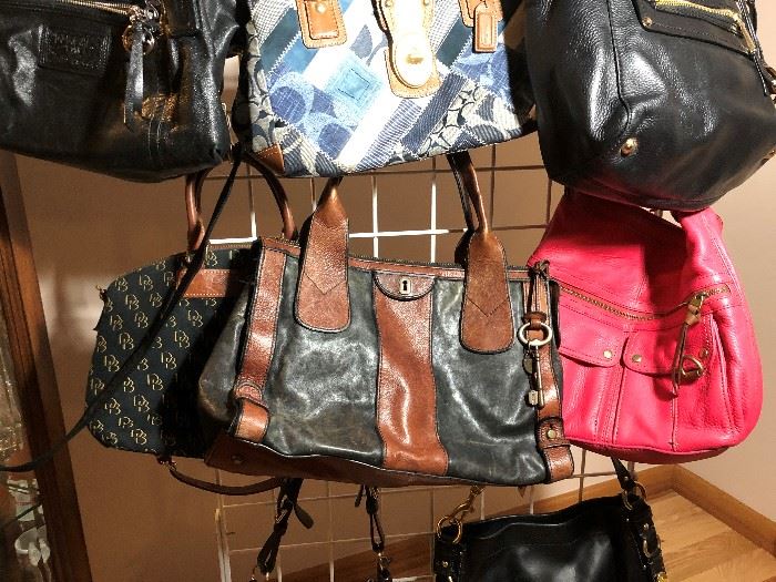 Dozens of designer purses including Coach, Michael Kors, Dooney and Bourke, Fossil, and more