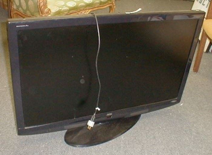Envision Series AOC 42" flat screen tv - monitor.  Had RCA, VGA, S-video imputs.  USB.  Back panel missing some of the frame.  See photos.  Tested and works. No remote