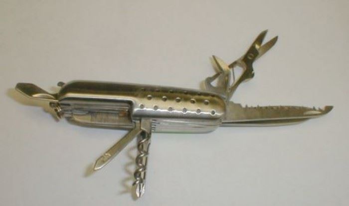 Mini Jaguar knife with multiple tools.  Like new condition.  Made in China