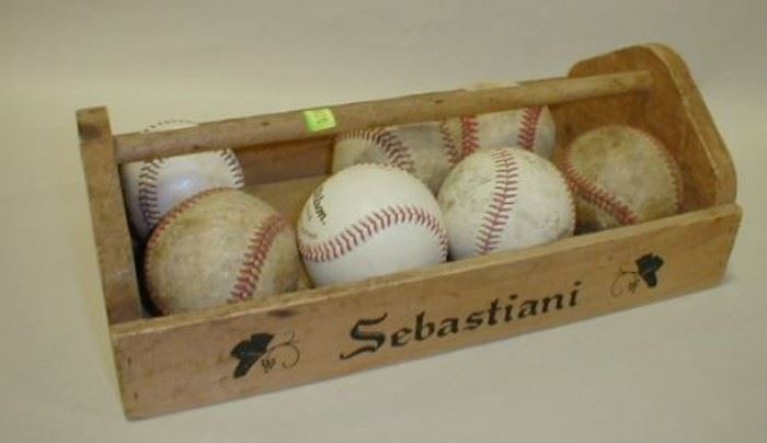used baseballs and a wood tray