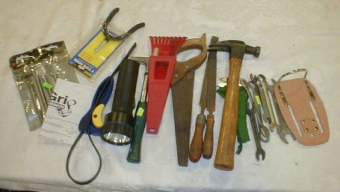 Hammer, flashlight, files, bottle opener, small saw, box wrenches, 