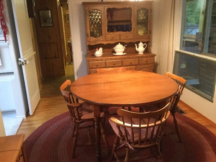 Maple dining set with two leaves for chairs and matching hutch