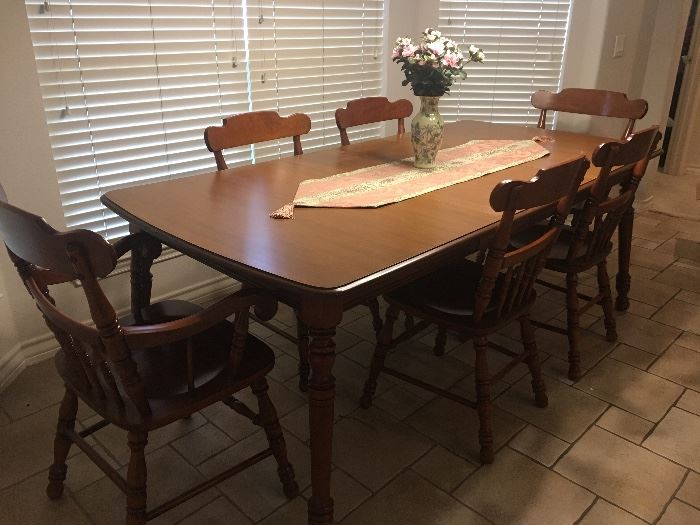  this table  and 6 chairs is in the kitchen 