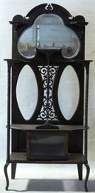 Intricately carved mahogany etagere