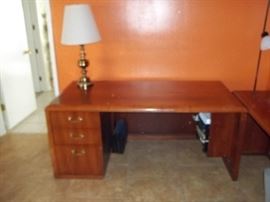 This desk has detached wing. 