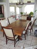 Solid wood dining room table with leaves, 2 captains chairs and 4 side chairs.