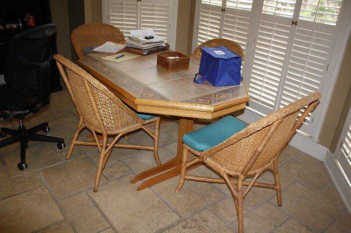 Handcrafted table by the owner with 4 wicker chairs