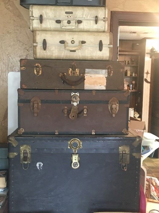 Assorted trunks and suitcases