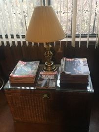 Wicker trunk, lamp and vintage magazines