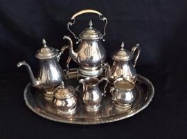 International Silver Co. Sterling Silver Coffee and Tea Set with Sterling Tray.  International Silver Co. Sterling Silver Coffee and Tea Set in Prelude Pattern | Includes: Coffee, Tea, Covered Sugar, Creamer, Open Sugar, Hot Water on Stand and Matching Sterling Oval Tray. Set weighs 198 troy ounces, in very good condition.
Dimensions: 198 ounces troy
Artist or Maker: International Silver Co.
Medium: Sterling Silver
Condition Report: In very good condition