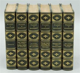 Leather Books from Personal Collection of Tom Clancy | Works of Emerson by Ralph Waldo Emerson | Boston and New York: Houghton Mifflin, 1929 | 6 volumes | The Books have been bound by the Heralded Henry Stikeman in 3/4 navy Moroccan leather over cloth, gilt-tooled and -lettered spines, t.e.g. Harvard edition. Stikeman & Co. (bookbinders) was the most prominent and celebrated (among his peers) art book binder in American History. Henry Stikeman’s career paralleled the heyday of art bookbinding in America: beginning toward the end of the 19th century and ending and ending well into the 20th. A Stikeman binding dating from 1880s through 1940s is considered the very best book bindings of recent history. Important Provenance: Ex-libris Elmer Holmes Bobst (1884–1978), American businessman, philanthropist, and namesake of the Elmer Holmes Bobst Library of New York University, with his bookplate to front paste-downs (6). Acquired directly from the Estate of the famous and popular author Tom Cl