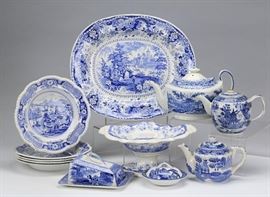 19th Century Arcadian Chariots 12 Piece Blue and White Transferware.  Antique 19th Century Ceramic Transferware / Dinnerware | Group of twelve blue and white transferware serving pieces | Each is beautifully decorated with flowers, landscapes and architectural scenes | The set includes the following pieces: * (5) soup bowls with a scalloped edge, stamped ‘India Temple,’ 2″h x 9.75″diameter, * (1) large platter, stamped ‘Italian Buildings,’ 2″h x 17″l x 14″w, * (1) oval teapot with lid, 7.5″h x 11″l x 6.5″w * (1) footed dish with a scalloped edge, stamped ‘Chinese Marine,’ 5.5″h x 12.5″l x 9.5″w, * (1) round teapot with lid and twisted handle, 5.75″h x 8.5″l x 5″w, * (1) covered cheese tray, stamped ‘Arcadian Chariots,’ 6.75″h x 8.5″w, * (1) covered butter tray with handles, 2.5″h x 5.5″dia; and * (1) teapot with lid, 5.5″h x 8.5″l x 4.5″w. 5.5″ x 16.75″ | Arcadian Chariots | 19th Century | 12 Piece Set | Transferware | Blue and White