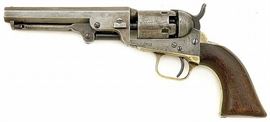Original Colt Model 1849 Pocket Police Revolver | Serial #187987 | .31 cal. Percussion. 5″ barrel still exhibiting strong rifling | The metal surfaces are gunmetal gray, with few isolated pockets of blue visible mostly in protected areas | The brass Grip Frame still retains about 20% of its nickel finish around the Trigger-guard and the upper Grip Frame | The bottom Grip Frame Screw appears to be a replacement. The one piece Walnut Grip rates good with approximately 40% varnish remaining. All appropriate parts are correctly numbered to the Frame except the Wedge which is unnumbered. The family of Colt Pocket Percussion Revolvers evolved from the earlier commercial revolvers marketed by the Patent Arms Manufacturing Company of Paterson, NJ. The smaller versions of Colt’s first revolvers are also called “Baby Patersons” by collectors and were produced first in .24 to .31 calibers, and later in .36 caliber, by means of rebating the frame and adding a “step” to the cylinder to increase dia