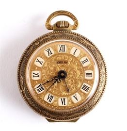 A gorgeous stem wind Louis XIV half hunter cased alarm pocket watch. This piece has an embossed gold tone metal case with a flip down back/stand. Delicate black hands point to roman numerals behind a plexus crystal. The alarm is set inside the back case and can be adjusted between fast and slow. Running condition when tested. Hallmarked with "Brevet + (Swiss Federal Cross) 227383" - which signifys that a Patent has been granted, and states the patent number. Case Metal Type: Gold Plated Base Metal Dial Markings: Louis XIV Movement: Swiss Serial Number: 227383 Markings On Inside: Brevet + 227383, Swiss Made 2.5″ x 2″ | Louis XIV | Pocket Watch | Stem Wind | Alarm | Gold Plated | Swiss
Artist or Maker: Swiss Made
Medium: Gold Plated
Condition Report: Very Good + Condtion