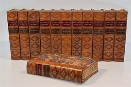Twelve (12) uniformly-bound works of Charles Dickens shown in the corresponding images | These antique volumes are published by Worthington Co. in New York 1890, and bound in half-leather. Works contain illustrations and/or plates by George Cruikshank and others | Among the works are Oliver Twist Cruikshank Plates Nickleby Boz Two Cities Pickwick Christmas | These antique volumes are solidly bound in half-leather with light to moderate external age/wear. The pages and plates show toning and scattered foxing. Each volume measures approximately 5.5" x 7.75".
Dimensions: 5.5" x 7.75"
Artist or Maker: Charles Dickens
Medium: Decorative Half Leather Binding
Date: 1890
Condition Report: Good - These antique volumes are solidly bound in half-leather with light to moderate external age/wear. The pages and plates show toning and scattered foxing.