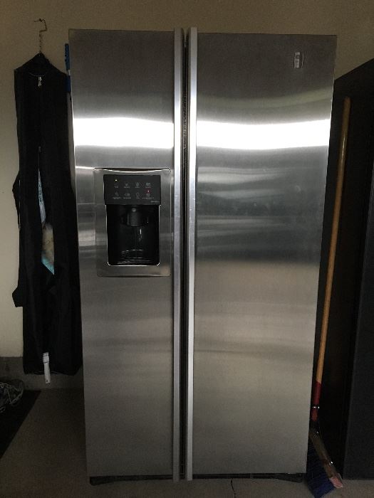 Stainless GE side by side refrigerator/freezer