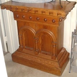 Nice old podium from a church.  Purchased from antique store in Little Rock several years ago.  Storage in back. 