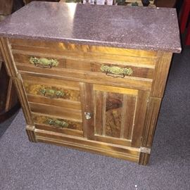  Antique wooden cabinet with red granite top 