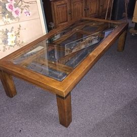  Vintage Drexel heritage coffee table. Made of solid oak,  brass embellishments, beveled glass top 