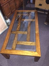  Vintage Drexel heritage coffee table. Made of solid oak,  brass embellishments, beveled glass top 