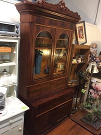  Beautiful walnut burled secretary with book hutch. This was made before the Civil War and has the original key. 