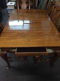  Beautiful solid oak dining table, 2-24 inch leaves, seven upholster chairs. 76 inches long, 45 inches wide. With the two leaves installed  The table is 124 inches long 