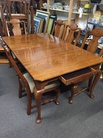  Beautiful solid oak dining table, 2-24 inch leaves, seven upholster chairs. 76 inches long, 45 inches wide. With the two leaves installed  The table is 124 inches long 