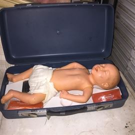 CPR training doll, infant. In case with supplies