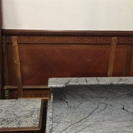 Antique bedroom suite from France late 1700s. Includes washstand with gray marble top, headboard and footboard, wardrobe, and small square table with gray marble top.