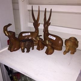Carved wooden elephants and antelope