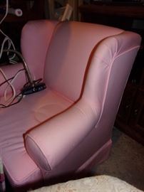 Cute child sized pink wing back armchair.