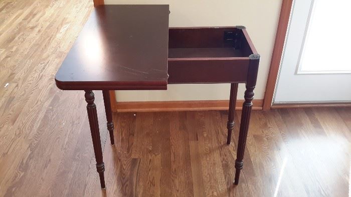 Vintage game table. Swivels and opens to access storage.
