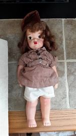 Vintage all-plaster doll with moving arms, legs and head. Hand painted eyes and lips.