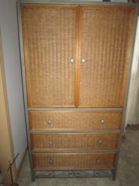 Wicker and metal armoire matches full bedroom suite