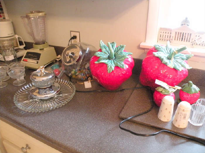 Retro strawberries for cookie jars. An assortment of salt & pepper shakers, cookie jars, glassware and appliances.