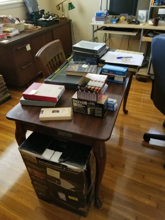 large office with office supplies books and desk and vintage cadenza with filing cabinet