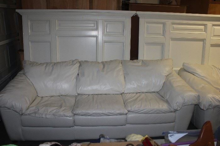 White leather sleeper sofa.  In the garage for easy loading
