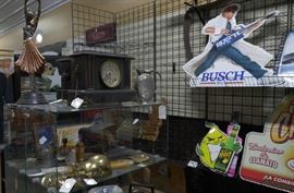 antique bronze statue, antique mantel clocks, vintage sign tins, vintage vase , vintage brass collections